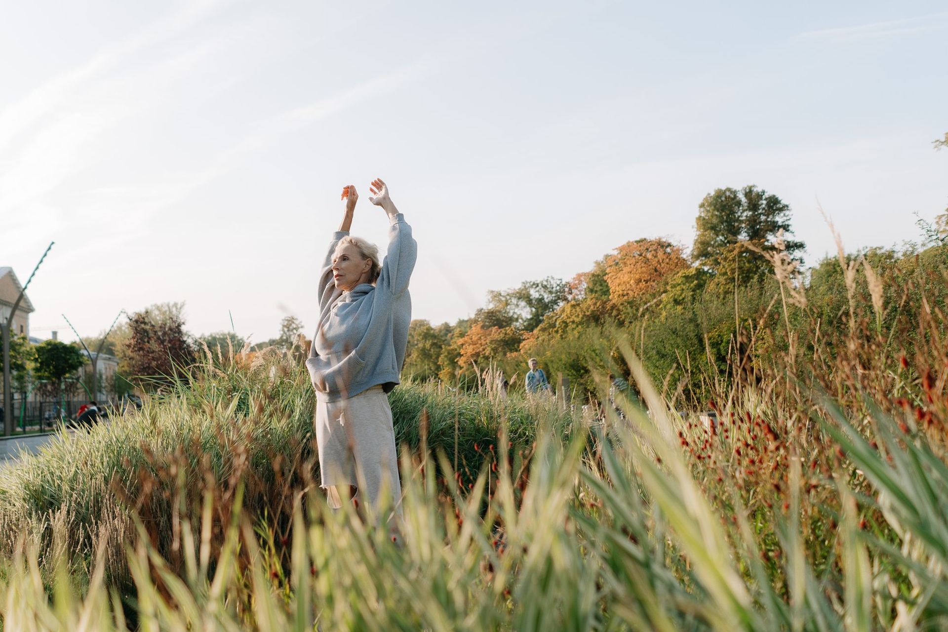 A woman outdoors in warm evening light